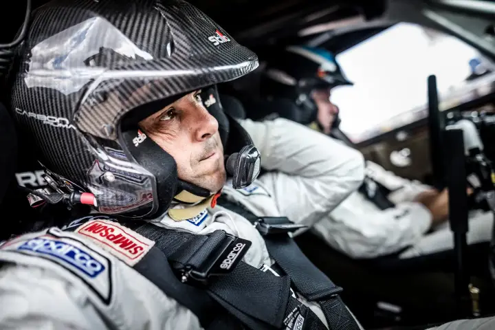 Baja Aragón 2017: driver in helmet seated focused inside cockpit