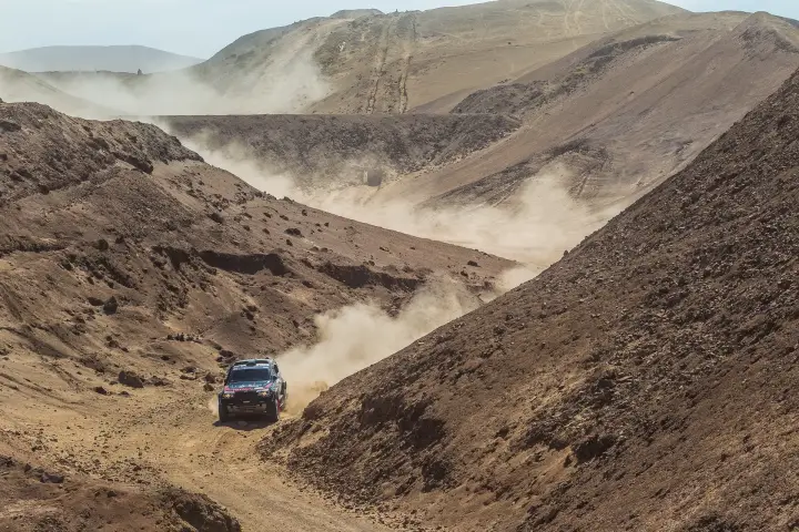 Dakar Rally 2013: BMW racing through dry river canyon valley