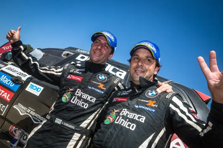 Dakar Rally 2013: two drivers smiling together after stage finish