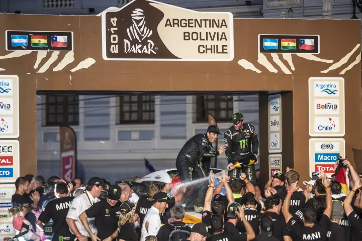 Dakar Rally 2014: Drivers spray champagne on Dakar podium