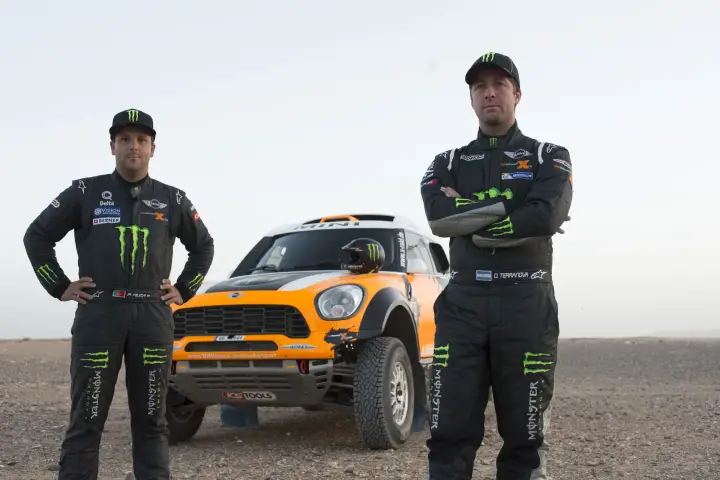 Dakar Rally 2014: Driver and navigator pose beside Mini buggy
