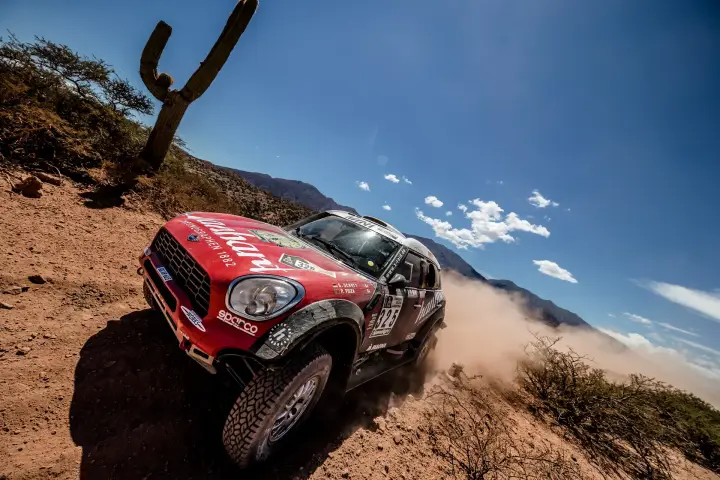 Dakar Rally 2017: Mini cornering beside tall cactus rocky terrain