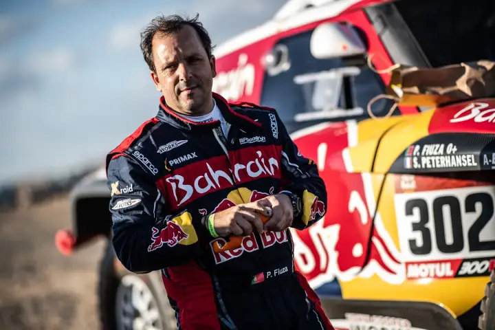 Dakar Rally 2020: Bahrain driver adjusting gloves beside car 302