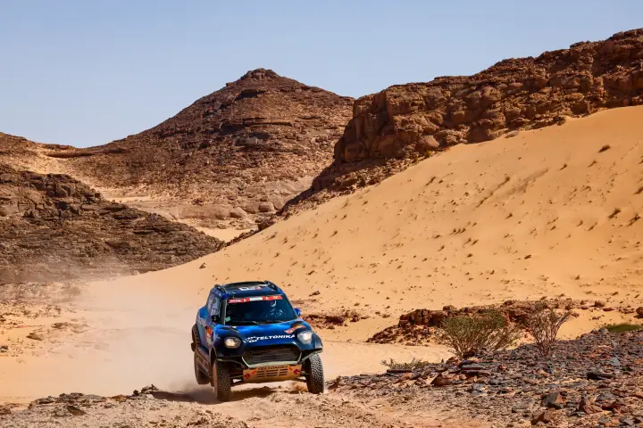 Dakar Rally 2022: blue Mini rally car in canyon terrain