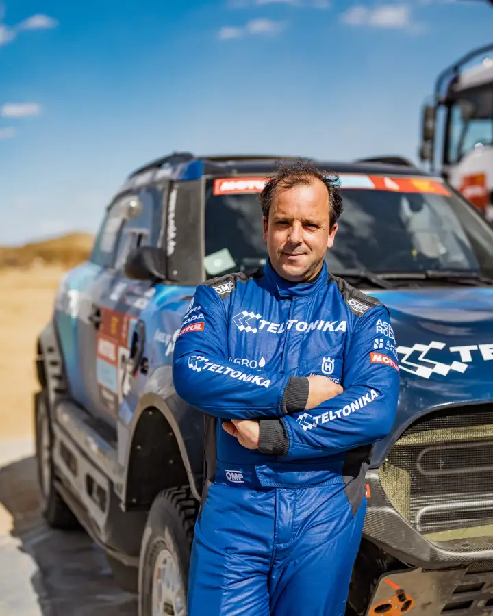 Dakar Rally 2022: driver arms crossed posing in front of car