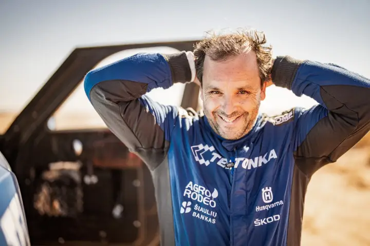 Dakar Rally 2022: smiling driver relaxing with hands behind head
