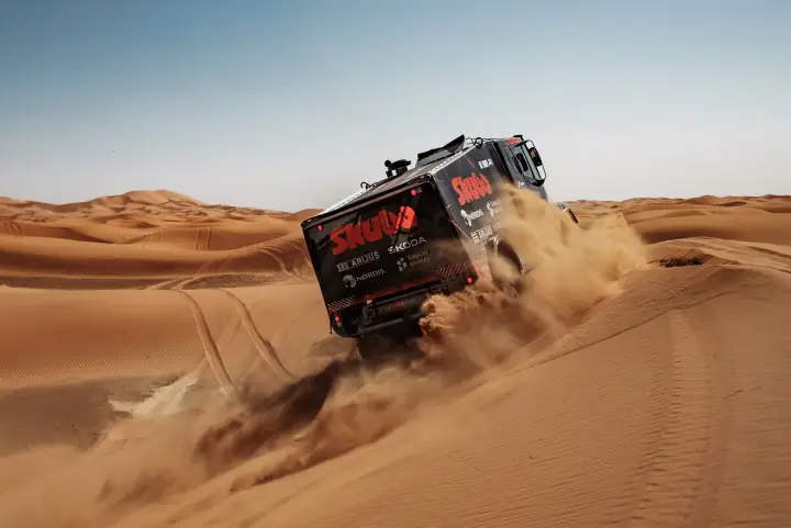 Dakar Rally 2025: Skuba Iveco truck rear view cresting sand dune