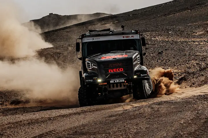 Dakar Rally 2025: Skuba Iveco truck head-on charging rocky dark terrain
