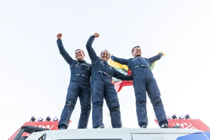 Dakar Rally 2026: Three winners raising fists atop truck roof