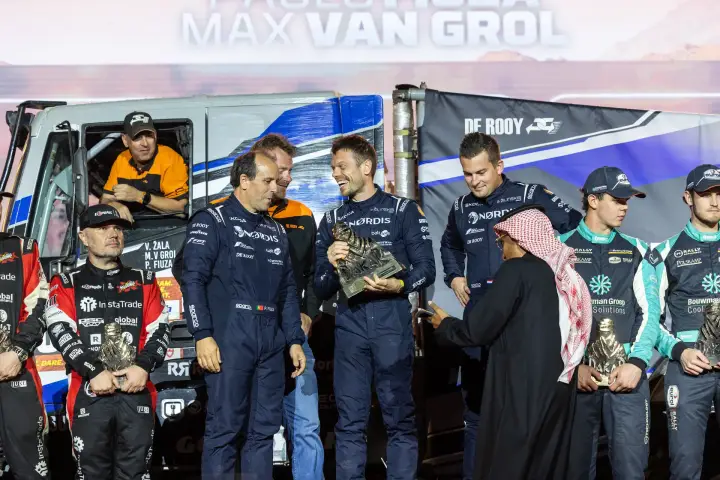 Dakar Rally 2026: NORDIS driver receiving trophy from Saudi official