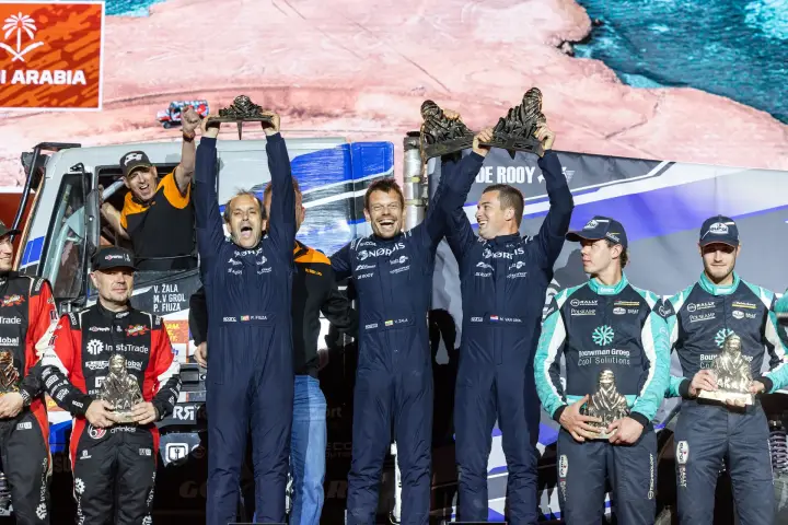 Dakar Rally 2026: NORDIS team celebrating with trophies on stage