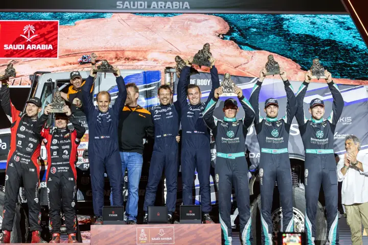 Dakar Rally 2026: Multiple teams on podium with trophies raised