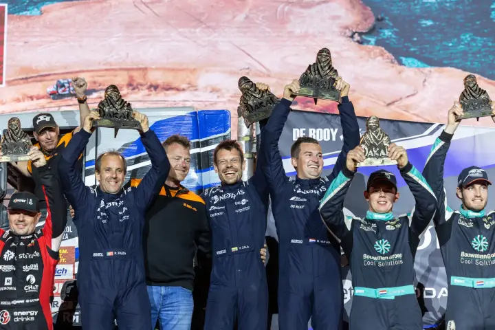Dakar Rally 2026: NORDIS team and rivals celebrating together onstage
