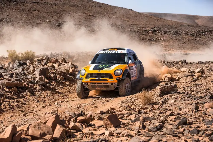 Rallye du Maroc 2013: orange Mini navigating rocky Moroccan mountain terrain